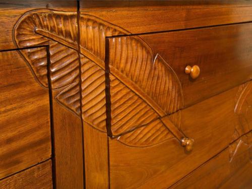 a wooden cabinet with a design on it at Marina Tower Waikiki in Honolulu