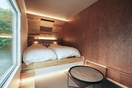 Ein Bett oder Betten in einem Zimmer der Unterkunft BLANC FUJI