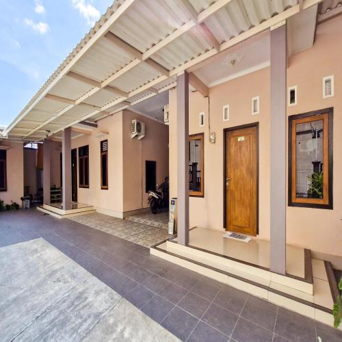 a view of a house with awning and a patio at TNC Residence Syariah Mataram in Mataram