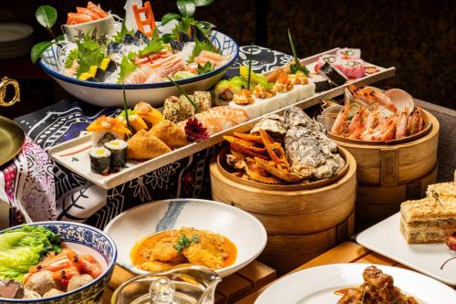 a table topped with lots of different types of food at Marco Polo Xiamen in Xiamen