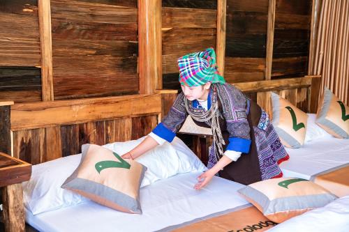 Postel nebo postele na pokoji v ubytování Lam Ecolodge Mu Cang Chai