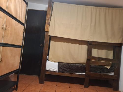 a pair of bunk beds in a room at Hotel La Xinca in Antigua Guatemala