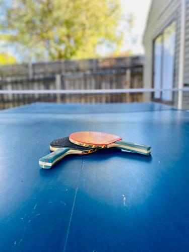 a wallet sitting on top of a blue table at Long Island Beach House gateway to Mornington Peninsula#Free parking in Frankston