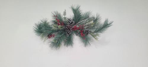 a christmas wreath with pine branches and berries at Large, Central, Lovely & Cozy 4bed/2bath - House by Everbank Stadium JACKSONVILLE in Jacksonville