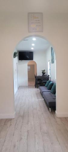 a living room with a couch and a table at Large, Central, Lovely & Cozy 4bed/2bath - House by Everbank Stadium JACKSONVILLE in Jacksonville