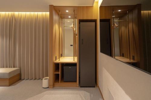 a bathroom with a sink and a mirror at H Avenue Hotel Gwangju Cheomdan in Gwangju
