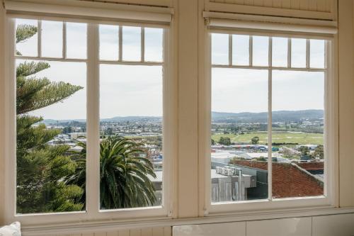 a window with a view of a city at Waratah On York in Launceston