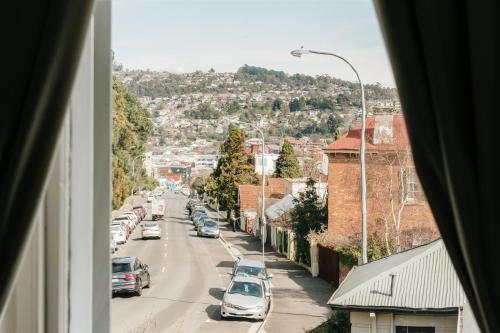 a view from a window of a street with cars at Waratah On York in Launceston