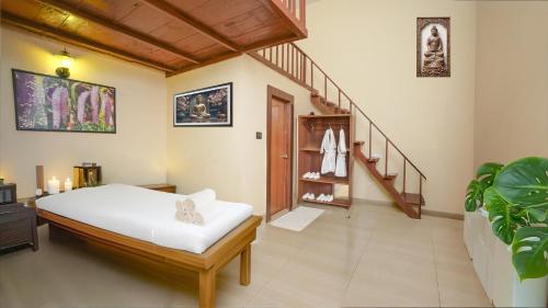 Ένα ή περισσότερα κρεβάτια σε δωμάτιο στο Summit Green Lake Tea Resort & Spa