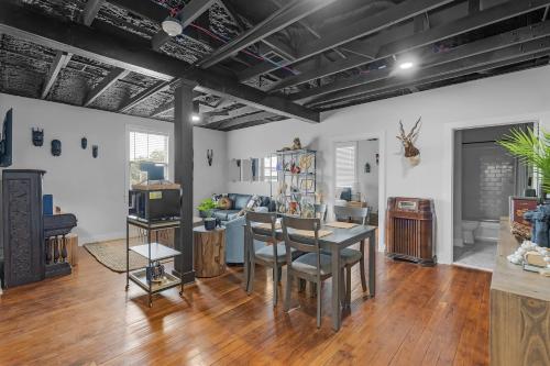 a living room with a table and chairs at The Sanctuary in Biloxi