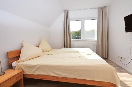 Postel nebo postele na pokoji v ubytování Ferienhaus Solhem Sechendorf