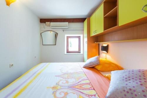 a bedroom with a bed with a dragon on it at Villa Mia -Three-Bedroom Villa with Swimming Pool in Trsteno