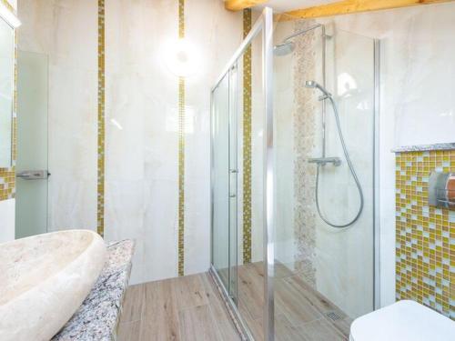 a bathroom with a shower with a tub and a sink at Villa Mia -Three-Bedroom Villa with Swimming Pool in Trsteno