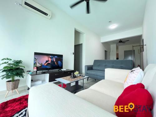 a living room with white furniture and a flat screen tv at New Listing Klang with Netflix Wifi Swimming Pool View in Klang