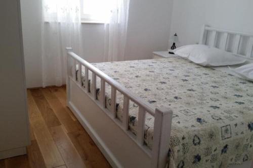 Ένα ή περισσότερα κρεβάτια σε δωμάτιο στο Apartments Villa Rustica ST - Two-Bedroom Apartment with Balcony and Shared Pool prizemlje