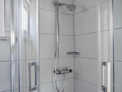 a shower with a shower head in a bathroom at Villa Tonika -Two Bedroom Apartment with Terrace A1 in Povlja