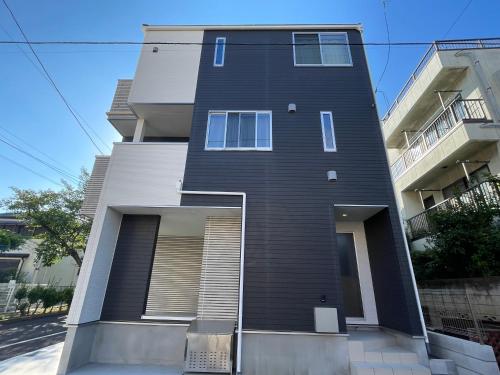 a tall black building with its door open at Starry Ocean in Tokyo