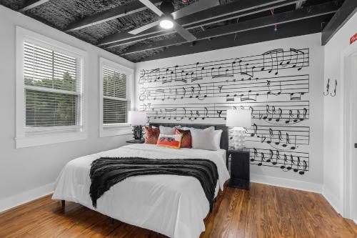 a bedroom with a wall covered in musical notes at The Sanctuary in Biloxi