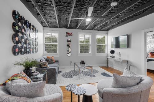 a living room with two couches and a table at The Sanctuary in Biloxi