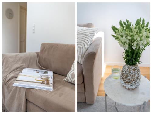 ein Wohnzimmer mit einem Sofa und einem Tisch mit einer Blumenvase in der Unterkunft Sanders Regent - Adorable One-Bedroom Apartment Near Central Square in Kopenhagen