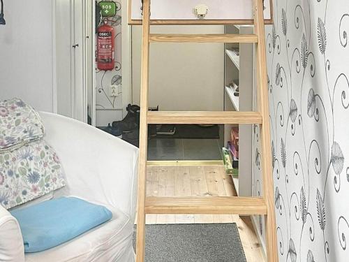 a ladder to a bunk bed in a room at 3 person holiday home in LINNERYD in Linneryd