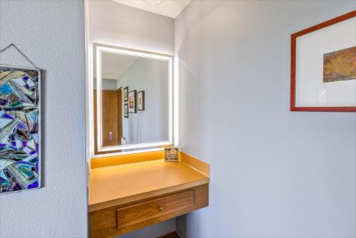 a bathroom with a dressing table and a mirror at Hi-Tide Resort in Moclips
