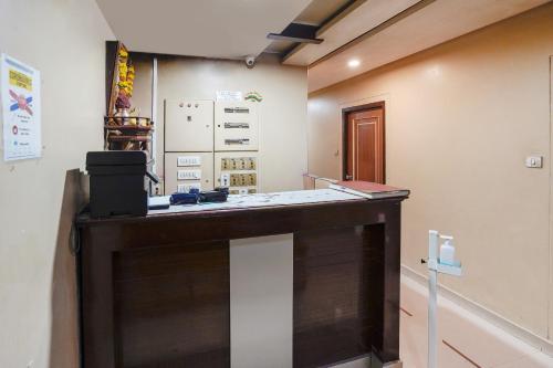 a room with a counter in a room at Collection O Sapna in Mire