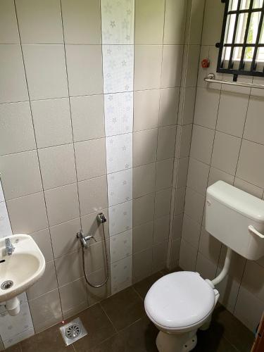 a bathroom with a toilet and a sink at Ayem Homestay UTHM in Parit Raja