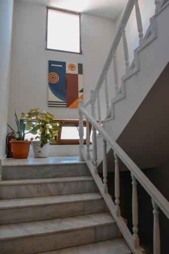 a staircase in a house with two potted plants at La Sorella in Dalyan