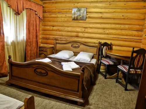 Postel nebo postele na pokoji v ubytování Gotel Milenium