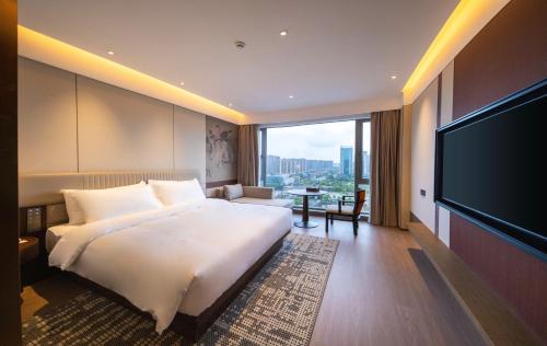 Postel nebo postele na pokoji v ubytování Maison New Century Hotel Cixi Hangzhou Bay