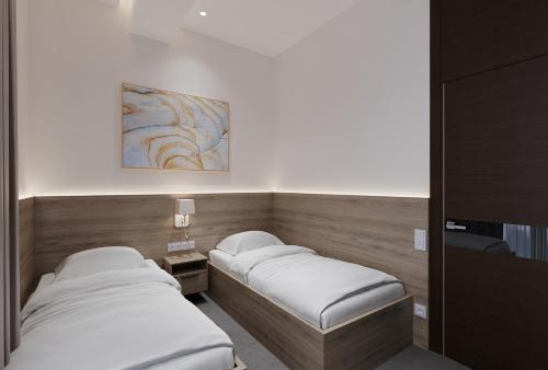 Кровать или кровати в номере Energy hotel Tashkent