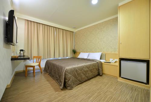 TV a/nebo společenská místnost v ubytování Ing Wang Hotel