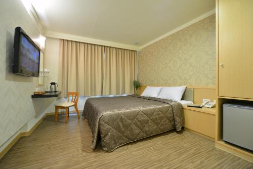 TV a/nebo společenská místnost v ubytování Ing Wang Hotel