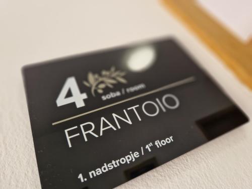 a close up of a francolo sign on a card at House Olive Garden Strunjan in Strunjan