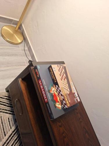 a group of books sitting on top of a cabinet at Elkhart Suites-siloam Shanzu in Shanzu