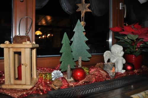 a table with christmas decorations and a computer keyboard at Pension Trojerhof in Heiligenblut