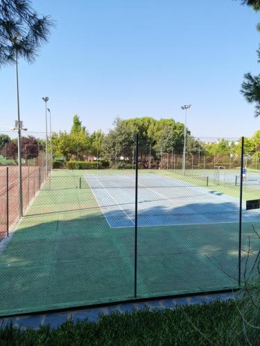 a tennis court with two tennis courts at Hotel Boutique Mirasierra in Villacañas