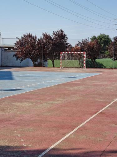 a tennis court with a net on top of it at Hotel Boutique Mirasierra in Villacañas