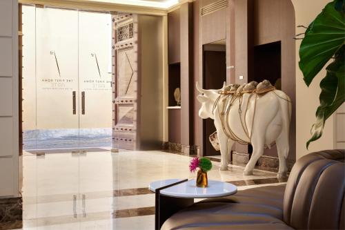 a living room with a couch and a table at The First Arte - Preferred Hotels & Resorts in Rome