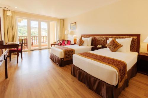 Postel nebo postele na pokoji v ubytování Sunny Beach Resort & Spa Mui Ne