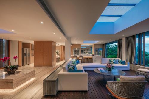 a living room with a couch and a table at Anantara Desaru Coast Resort & Villas in Desaru