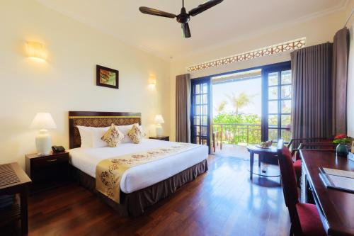 Postel nebo postele na pokoji v ubytování Sunny Beach Resort & Spa Mui Ne