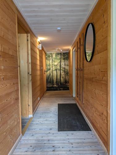 a hallway of a house with wooden walls and a window at Apartments Pihapperhof in Mittersill