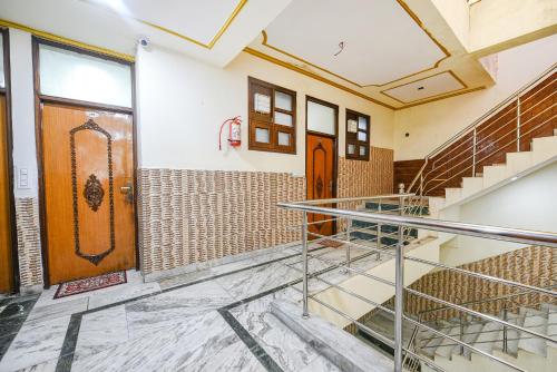 an empty room with two doors and stairs at FabHotel Royal Inn in Chandīgarh