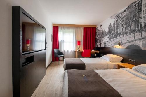 Postel nebo postele na pokoji v ubytování Bastion Hotel Leiden Oegstgeest