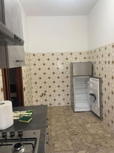 a kitchen with a small refrigerator in the corner at Tra mare e collina house free parking in Porto SantʼElpidio