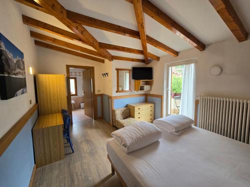 Una cama o camas en una habitación de Hotel Miramonti