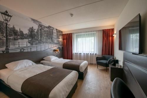 TV a/nebo společenská místnost v ubytování Bastion Hotel Dordrecht Papendrecht
