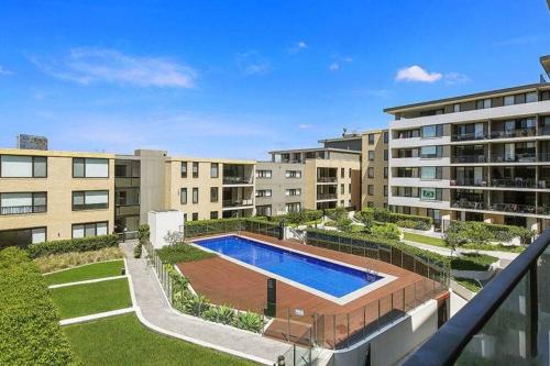 an apartment complex with a swimming pool on a balcony at Fantastic Waterview 1 bedroom apt for 4 sleeps in Sydney